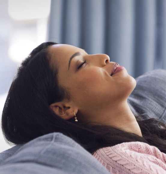 A woman sleeping soundly after receiving custom oral appliance therapy for sleep apnea.